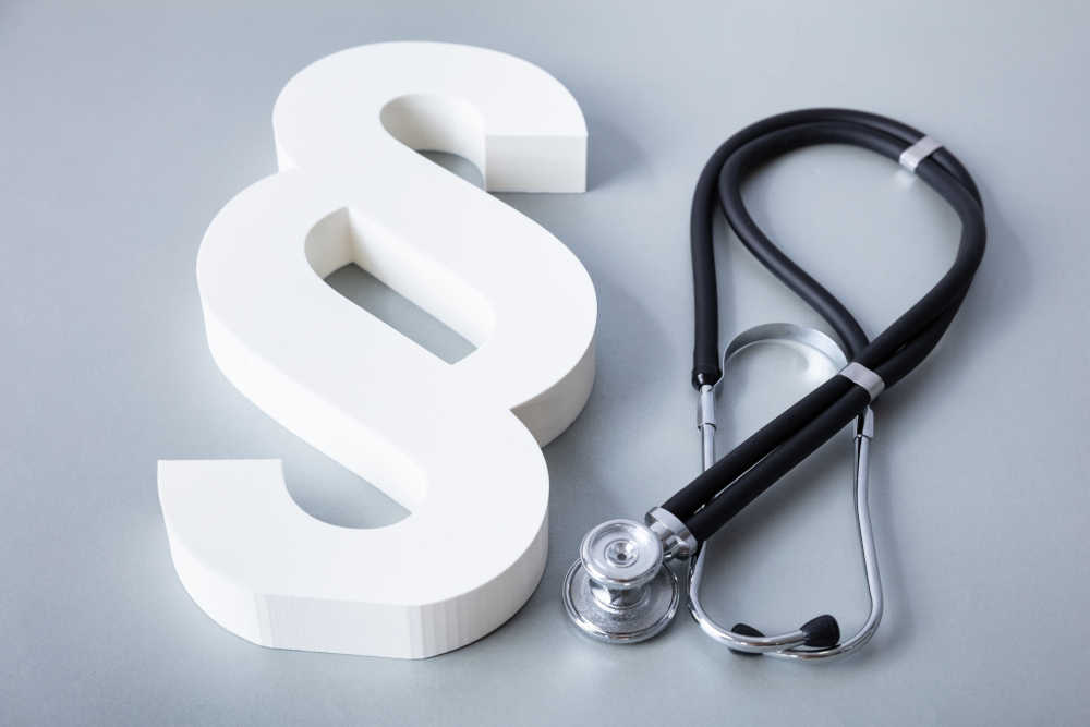 Close-up Of Stethoscope And Paragraph Symbol